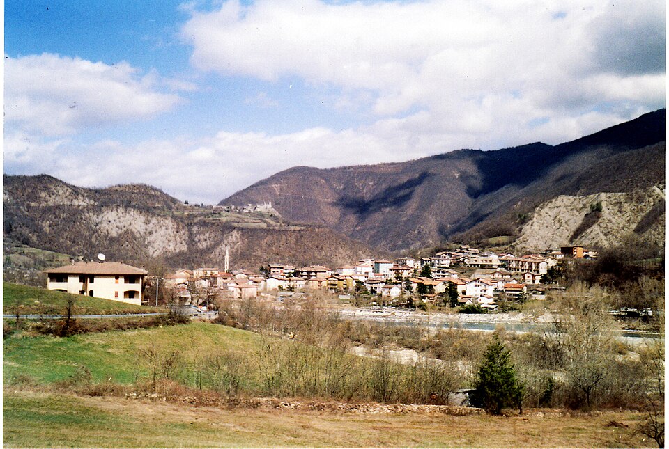 Panoramic view of Marsaglia on the valley floor and Brugnello on the ridgeline above in Corte Brugnatella