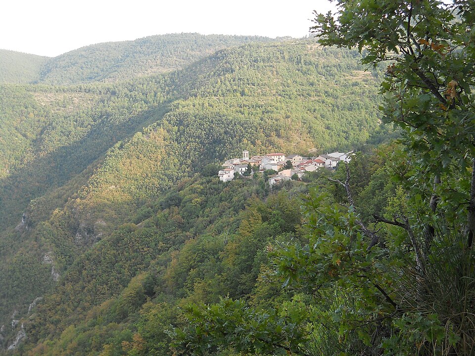 Panoramic view of Nortosce, a mountain hamlet of Cerreto di Spoleto, seen from the road contouring the mountainside