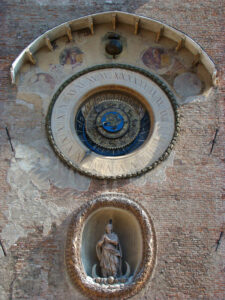 Piazza delle Erbe, Mantua, Lombardy, Italy. 15th Century astronomical clock on the face of the Torre dell'Orologio, Pala — Mantova